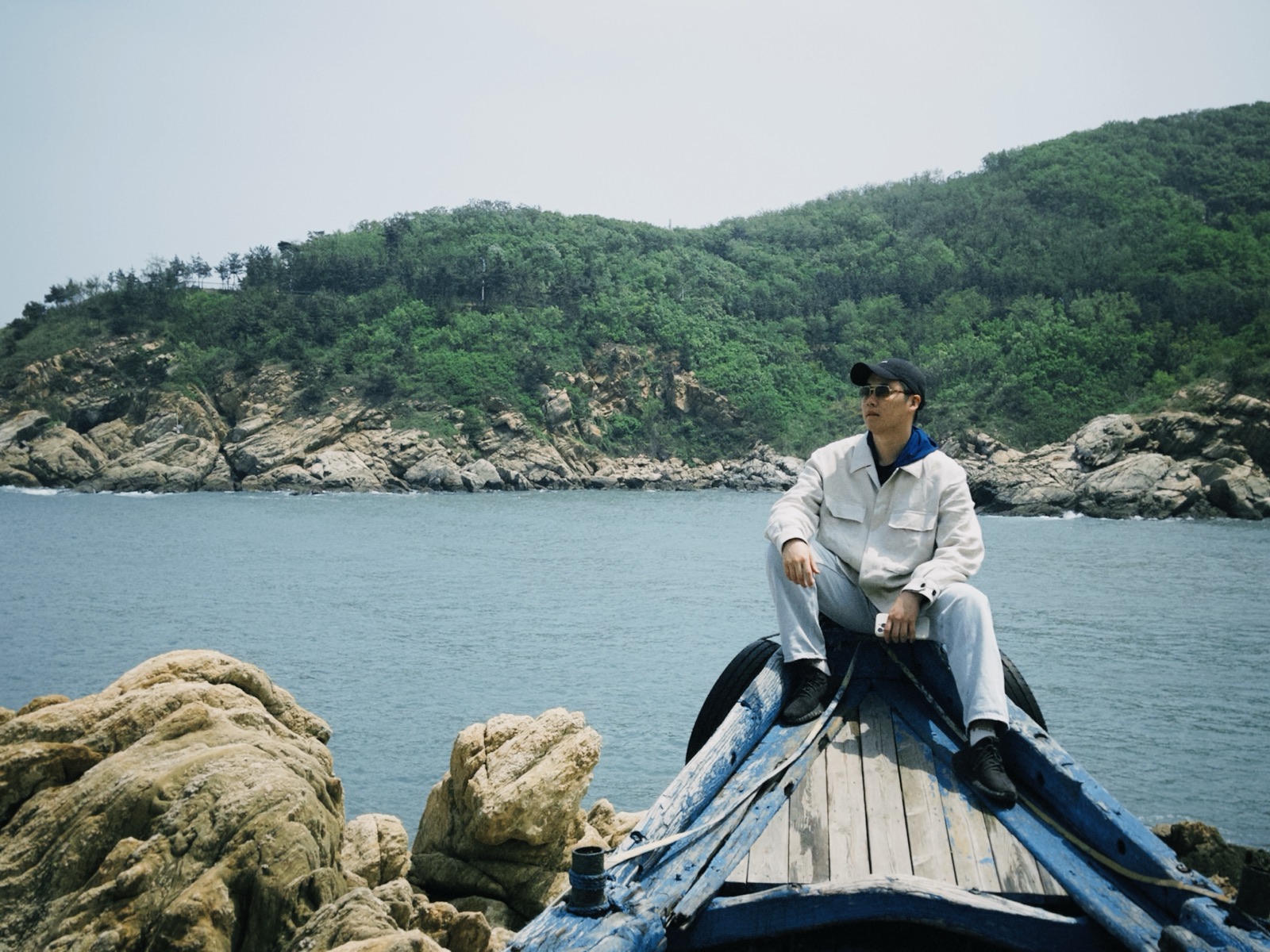A portrait of Linkai Li during a trip in China