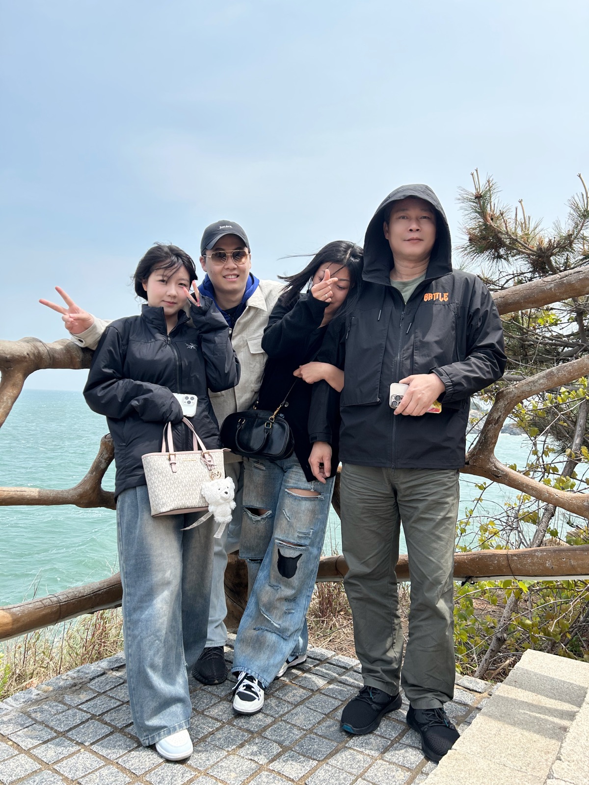 Linkai Li standing with family during a trip in China